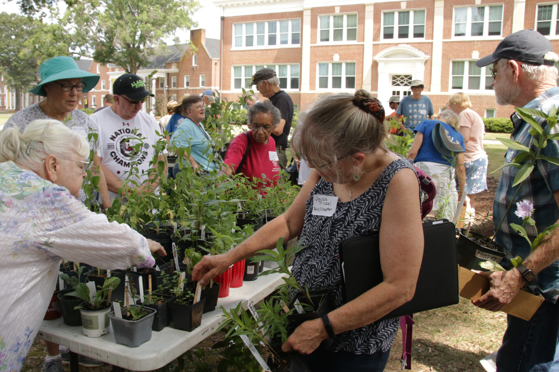 NCNPS members happily shopping for plants