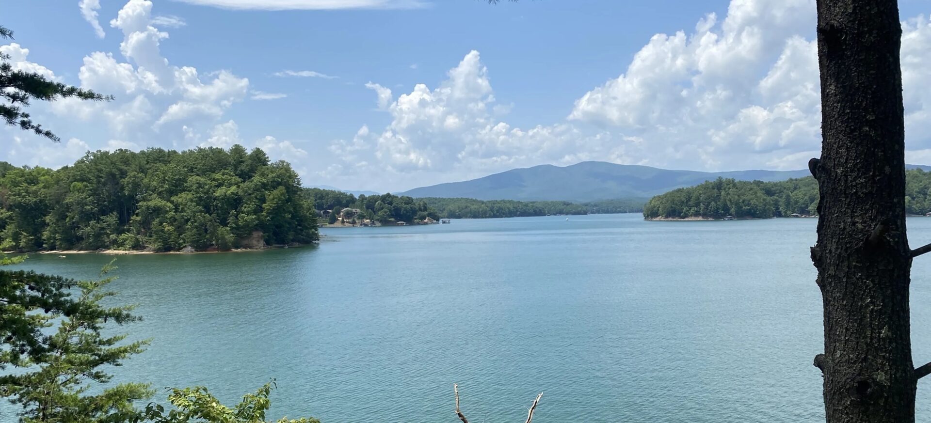 lake james in the foreground with mountains in the distance